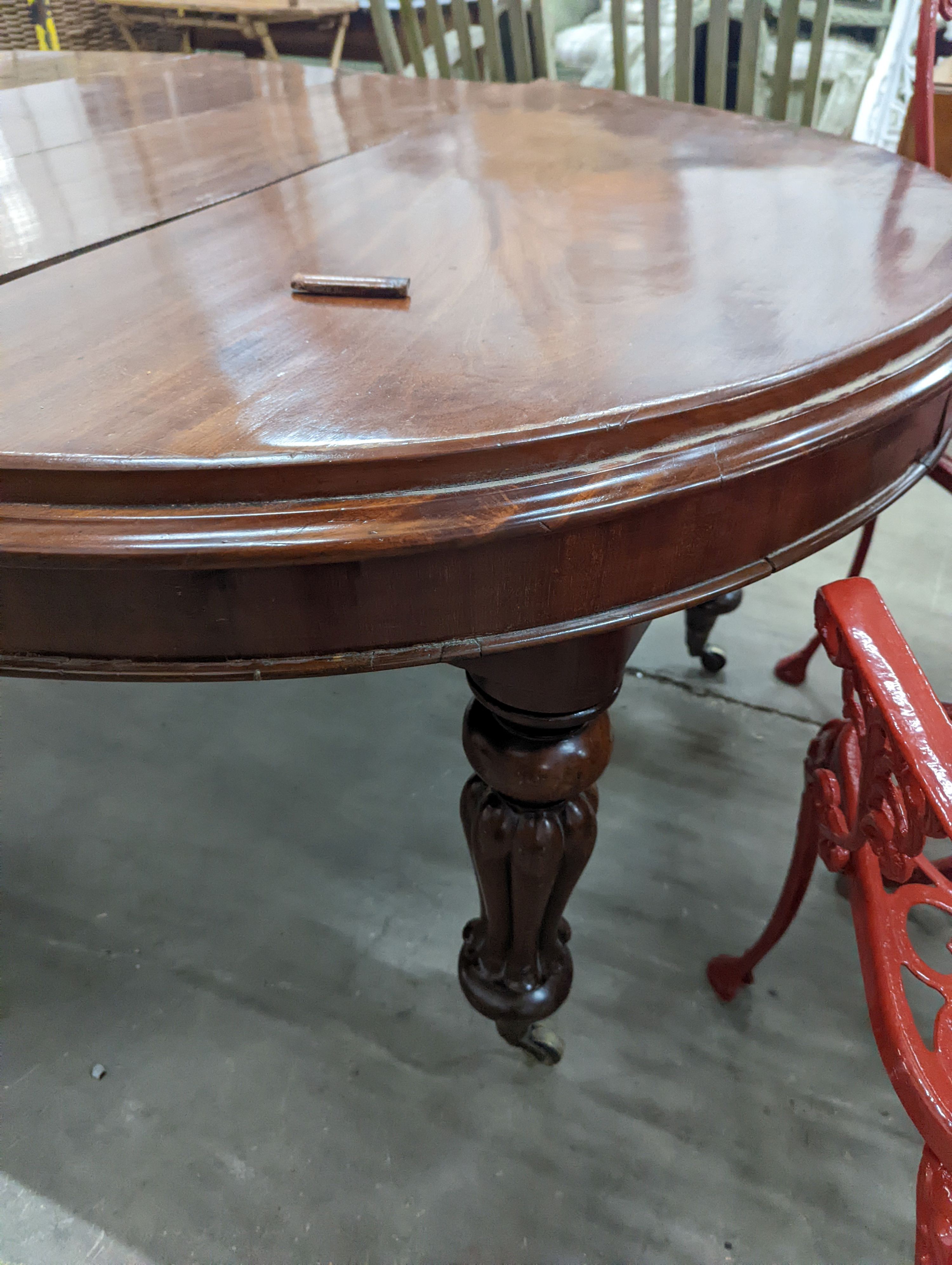 A Victorian mahogany extending dining table, length 170cm extended (two spare leaves), width 119cm, height 71cm